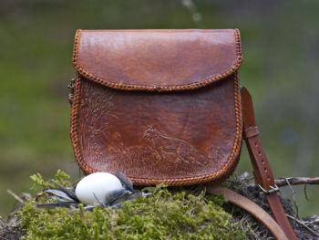 Leather handbag with carved fox