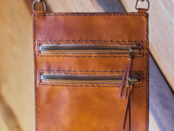 Brown leather neck wallet with zippers