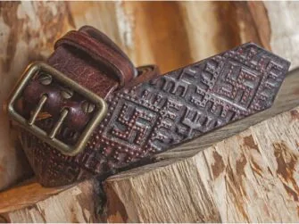 Wide leather belt with old swastika pattern