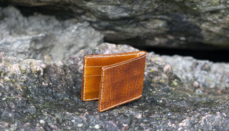 Card wallet on a grey stones background.