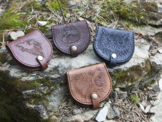 Coin pouches on a mossy rock