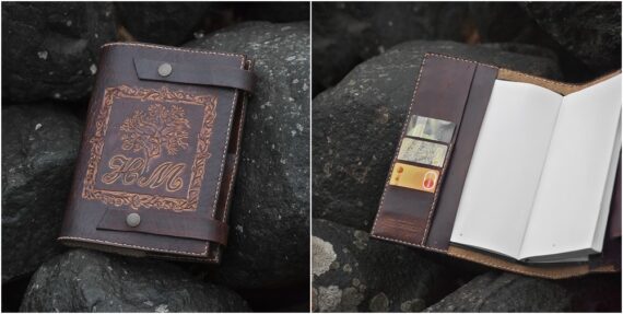 Leather covers for a notebook with initials and a tree