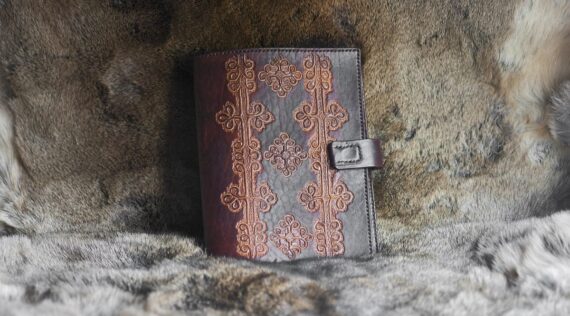 Leather notebook covers with hand carved folk pattern from Viljandi, Estonia