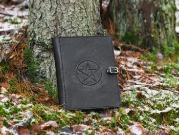 Leather covers with carved pentagram