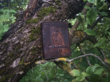 Dark brown leather wallet, decorated by hand carved eagle image.