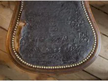 Old leather covers of the chair.