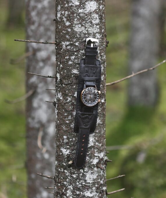 Black leather watch strap with underlying