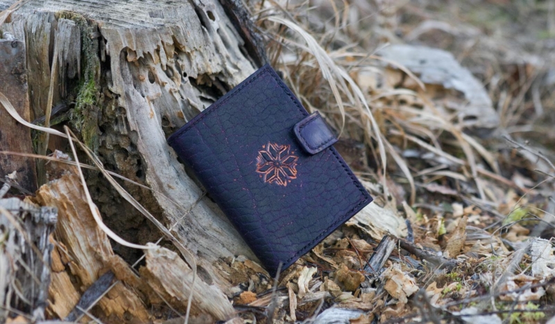 Violet leather wallet with eight pointed star